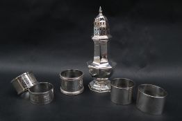 A late Victorian silver sugar caster with a pointed finial and pierced octagonal domed top on a