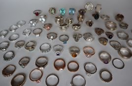 A large collection of silver dress rings,