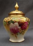 A Royal Worcester pot pouri vase and cover, the cover with a pointed finial and pierced top,