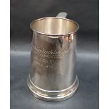 An Elizabeth II silver tankard of tapering cylindrical form, with a scrolling handle,