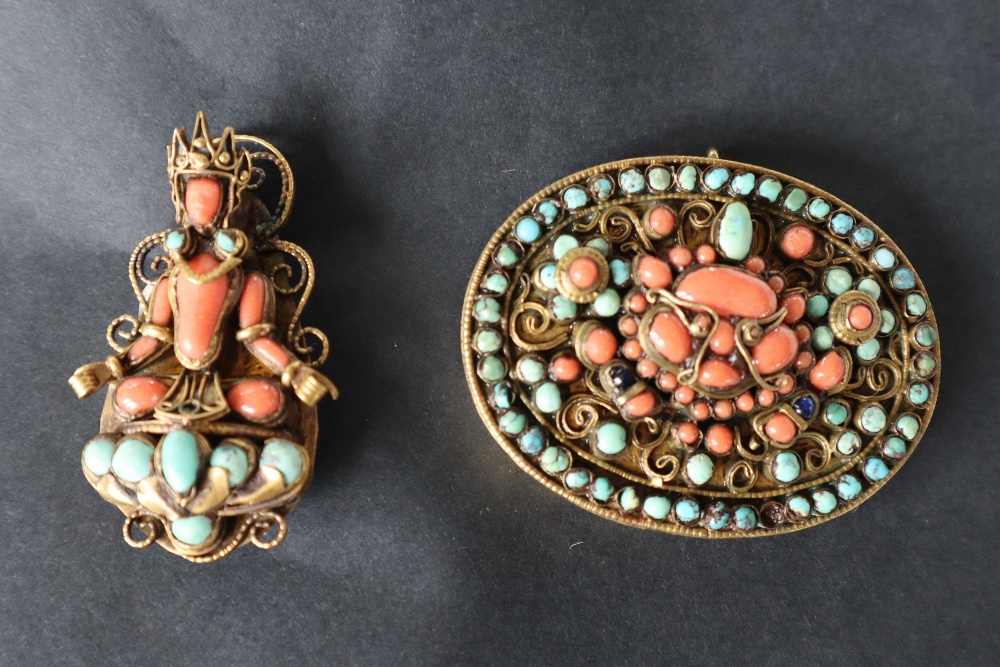 A coral and turquoise brooch of oval form to a gilt metal wirework setting,