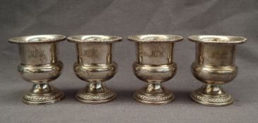American Silver - a set of four Sterling silver pedestal urns, 7.