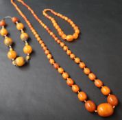 An amber bead necklace together with two other beaded necklaces CONDITION REPORT: