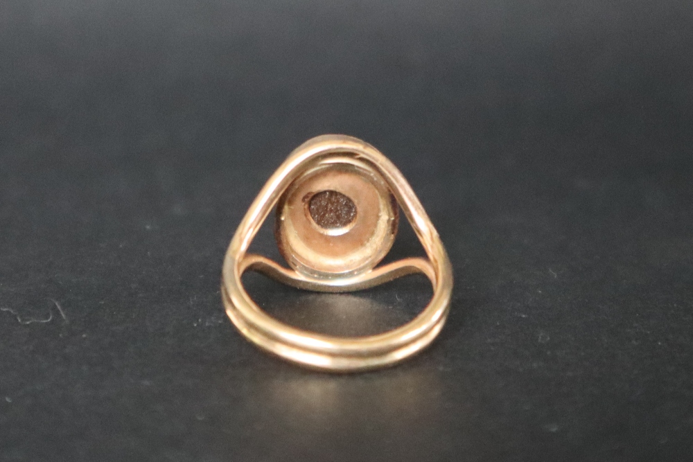 A 9ct gold ring, set with an oval opal panel, size M, approximately 5. - Image 4 of 5