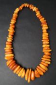 A string of irregular amber beads,