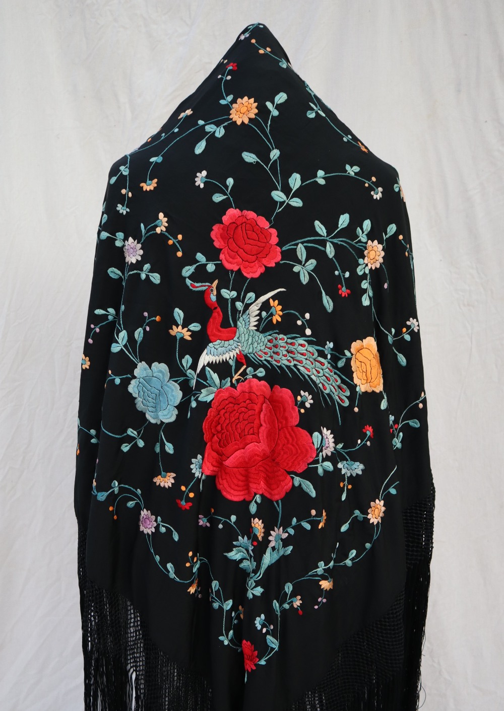 A silk piano shawl, the black ground profusely embroidered with peacocks, - Image 2 of 16