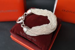 An Old Florence silver bracelet in the form of multiple chains and beads, approximately 76.
