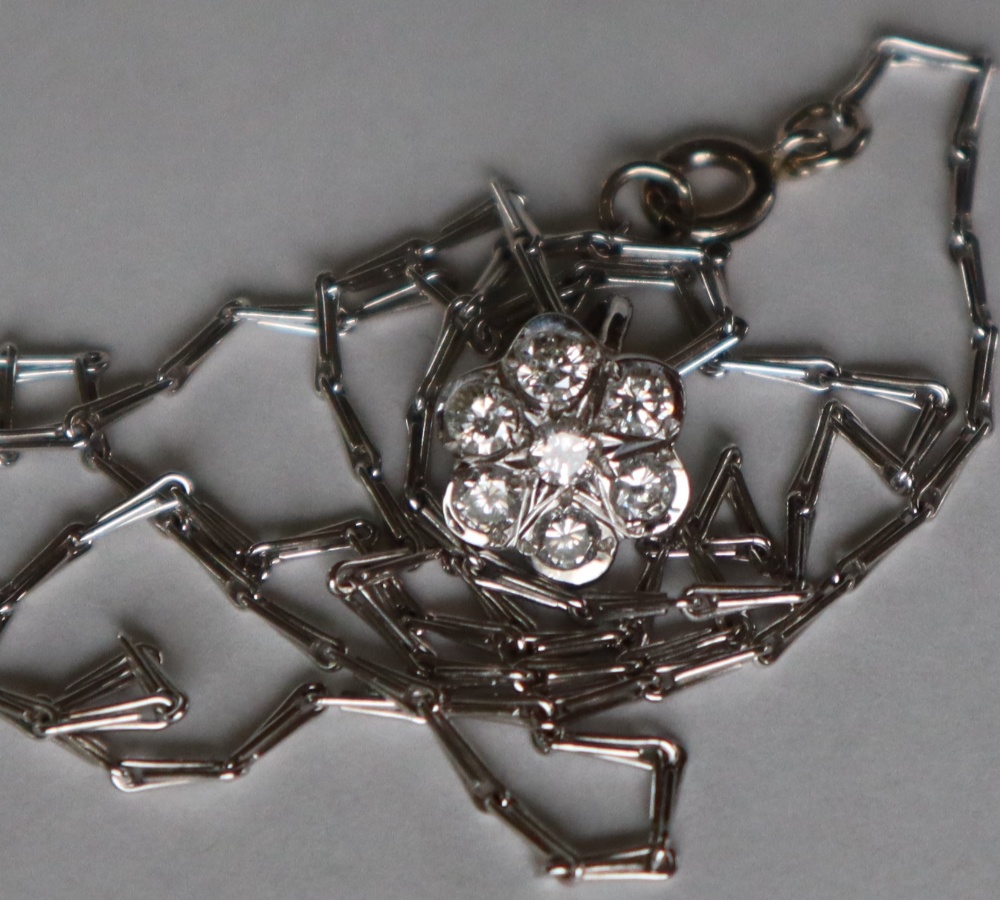 An 18ct white gold diamond set pendant of floral form set with seven round brilliant cut diamonds - Image 2 of 7