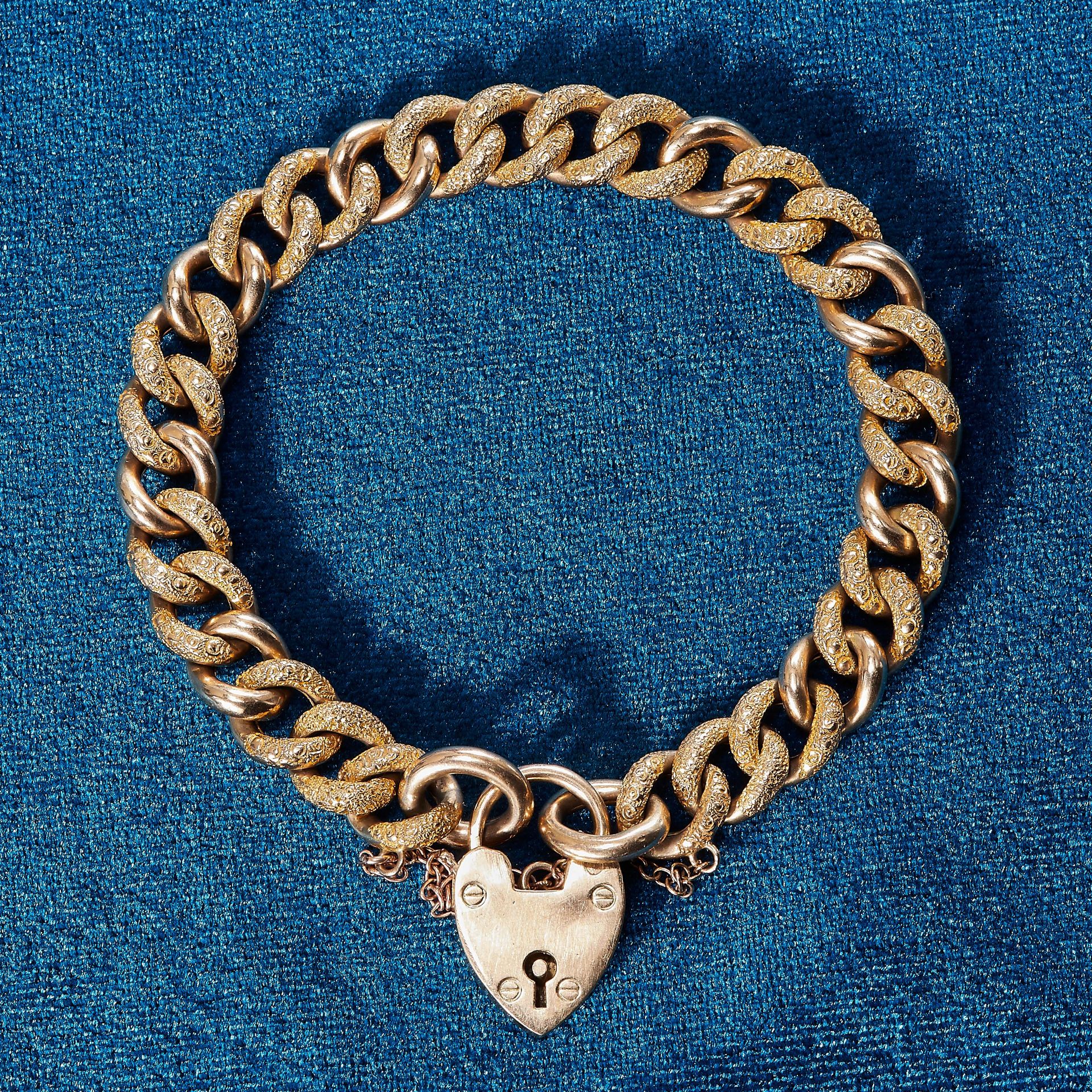 CURB LINK BRACELET WITH HEART PADLOCK CLASP