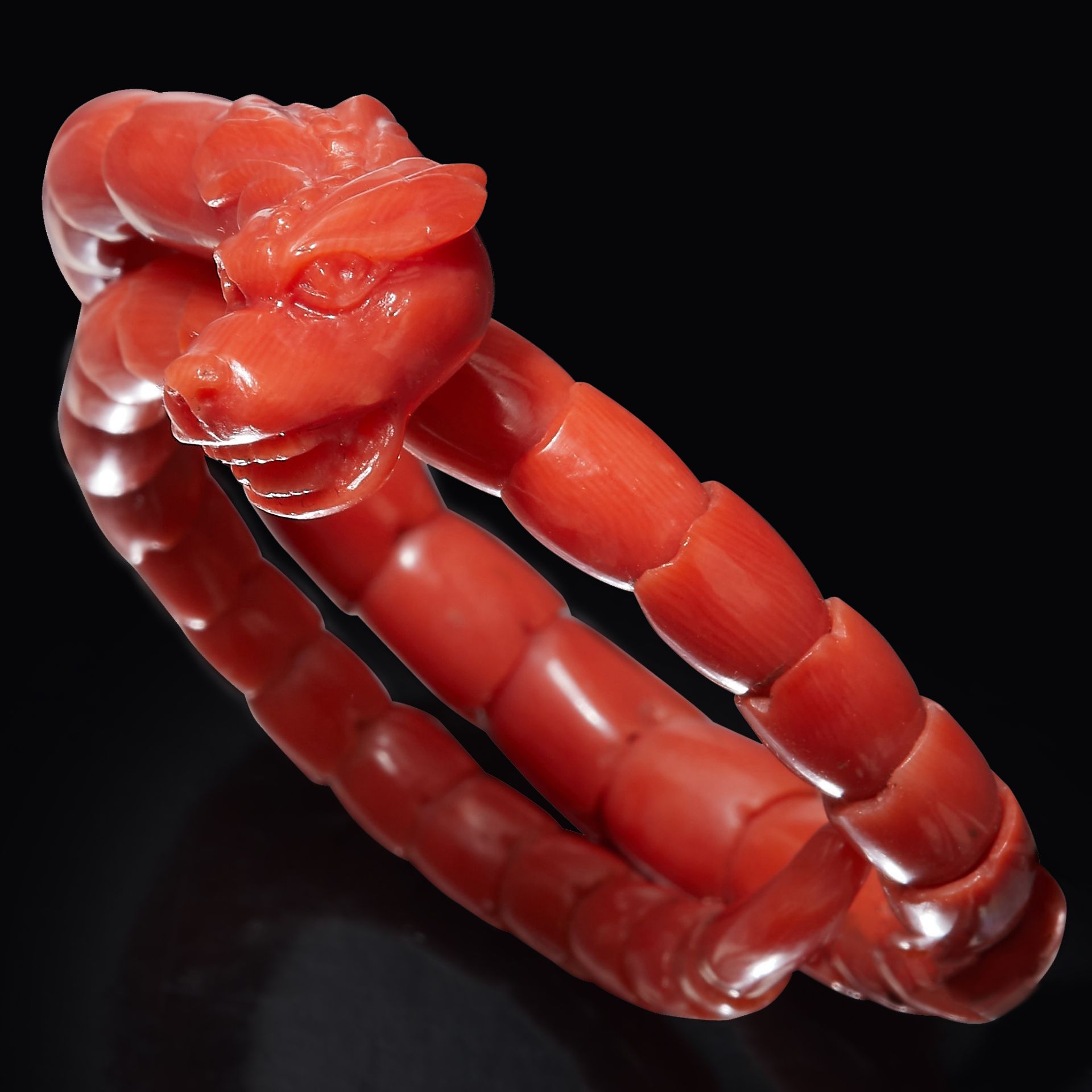 ANTIQUE CORAL DRAGON/CHIMERA SPRUNG BANGLE