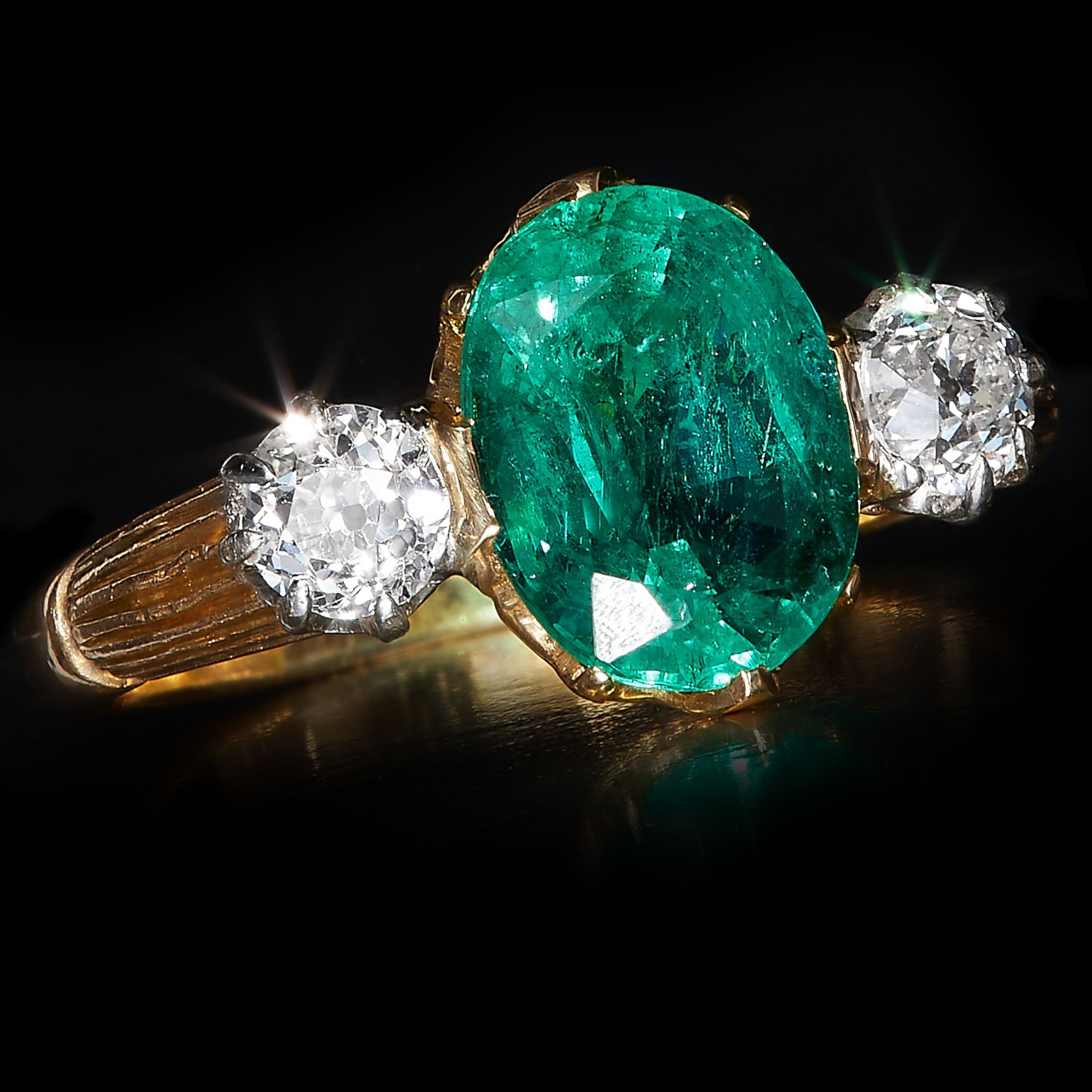 EMERALD AND DIAMOND 3-STONE RING