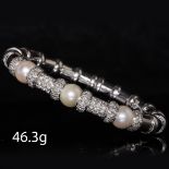 DIAMOND AND PEARL SPRING BANGLE