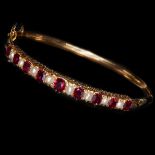 FINE RUBY AND PEARL HINGED BANGLE