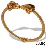 FINE DOUBLE RAMS HEAD GOLD BANGLE.