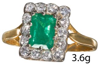 EMERALD AND DIAMOND CLUSTER RING.