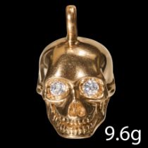 DIAMOND SKULL PENDANT 18 ct. gold. The eyes set with a bright and lively diamond. L. 1.9 cm. 9.6 gra