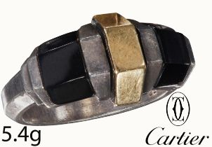 CARTIER, RARE AND UNUSUAL GOLD, SILVER AND ONYX RING. INSPIRED BY JEAN DESPRES