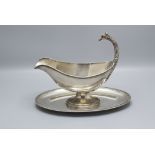 Sauciere mit Adlerkopf / A silver gavy boat with an eagle head shaped handle, Louis Coignet, ...