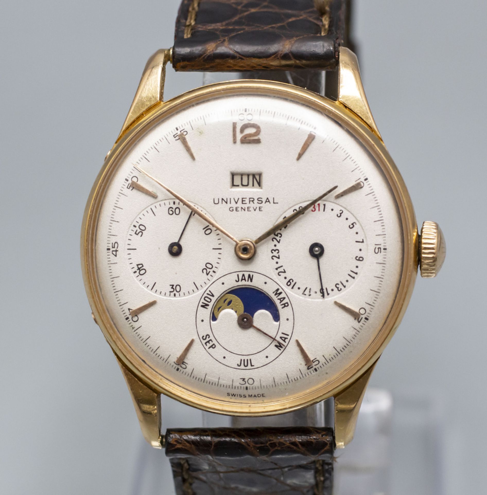 Armbanduhr mit Kalender / An 18 ct gold wristwatch with calendar, Universal Geneve, um 1950