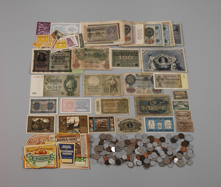 Convolute of banknotes, coins and labels