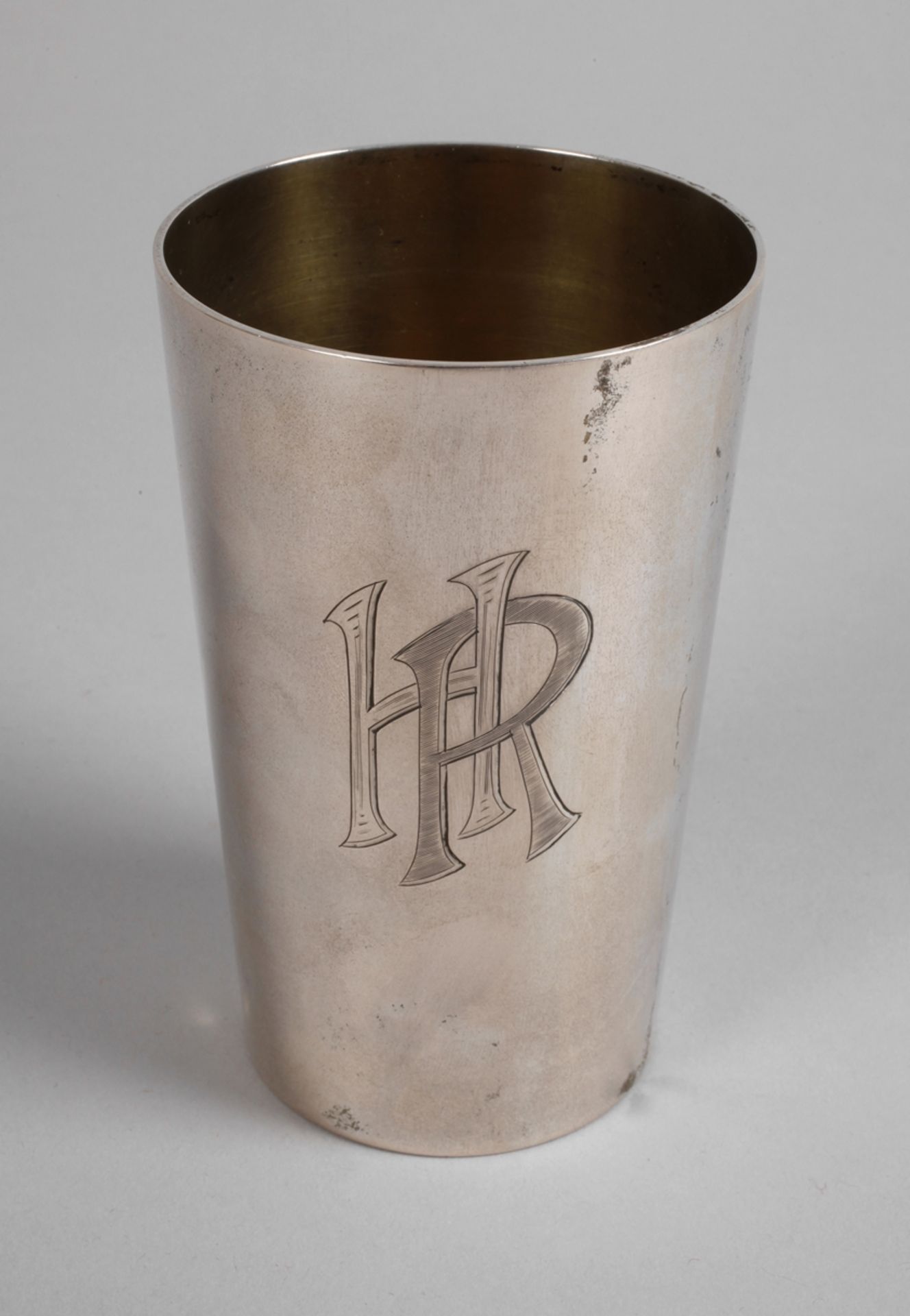 Large silver cup with monogram