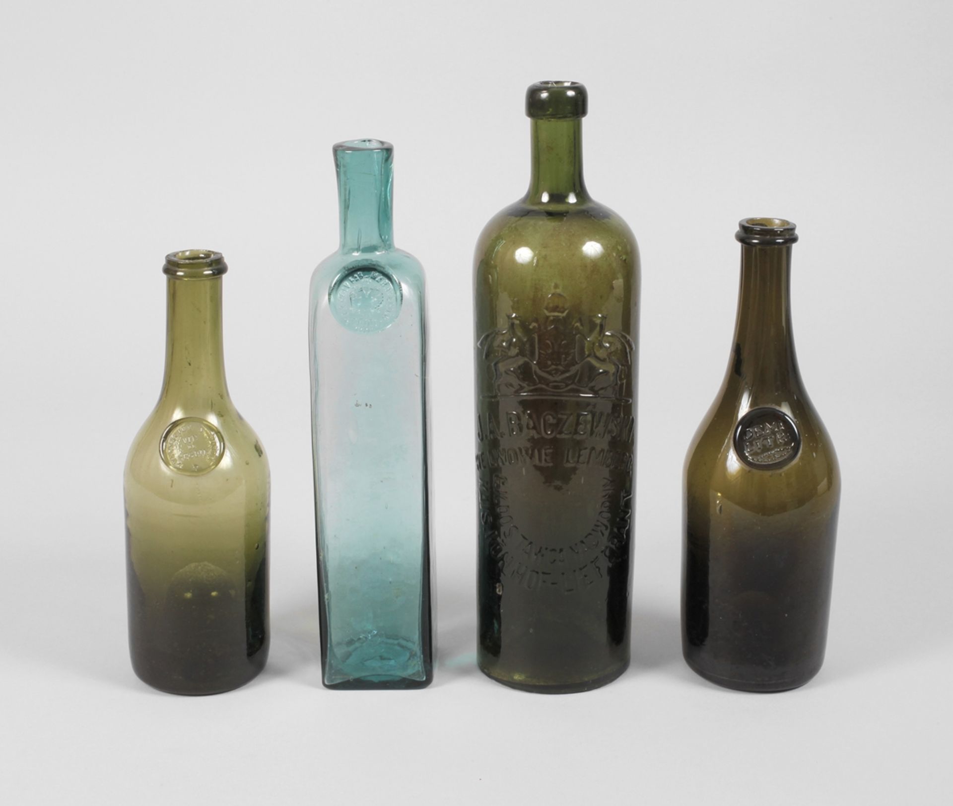 Four historical wine bottles