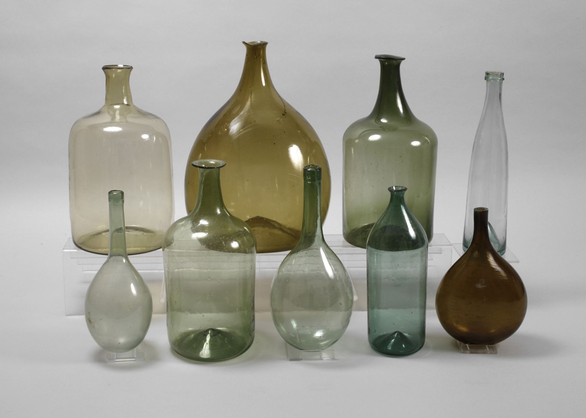 Nine historical glass bottles