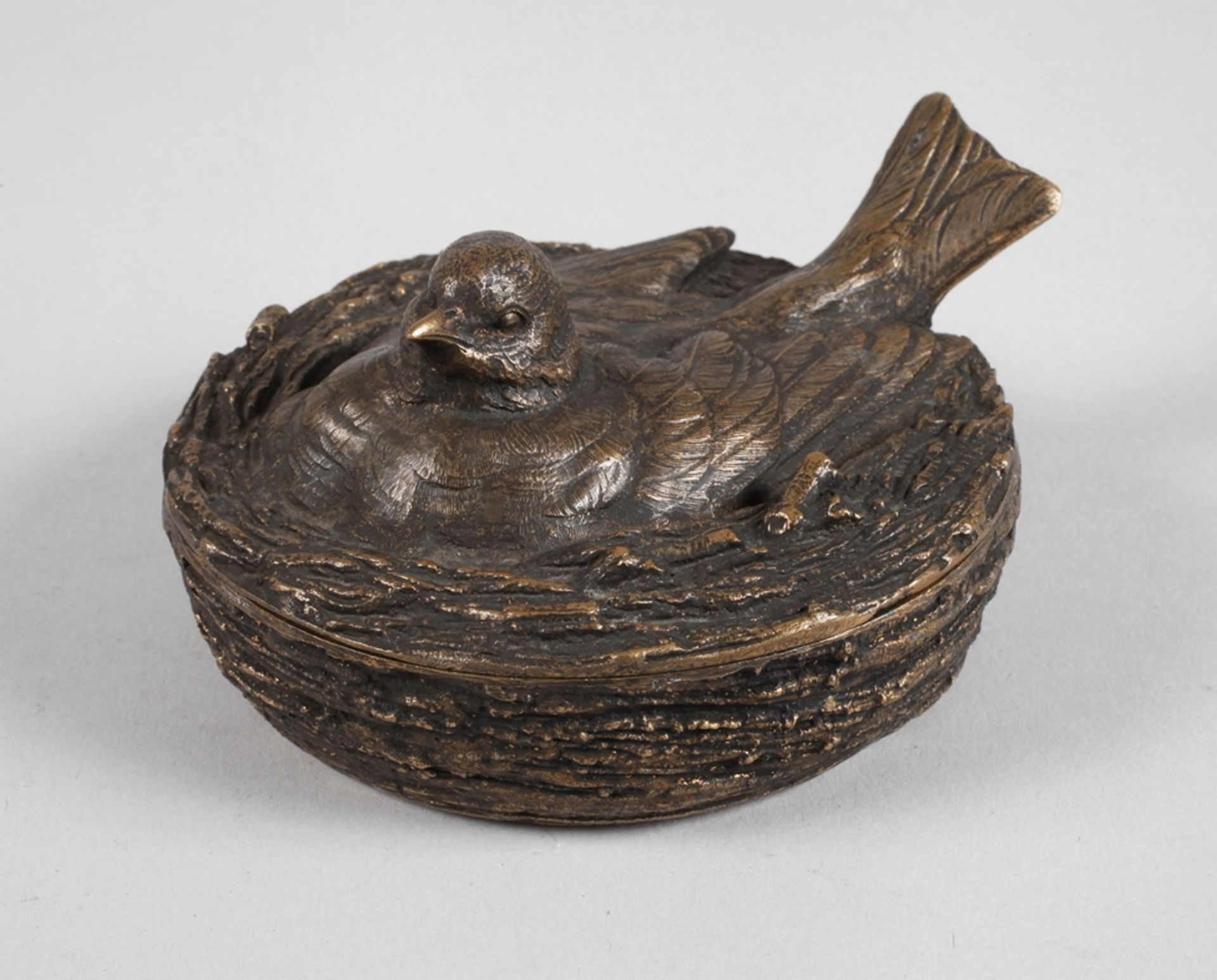 Figural lidded box as a bird in a nest