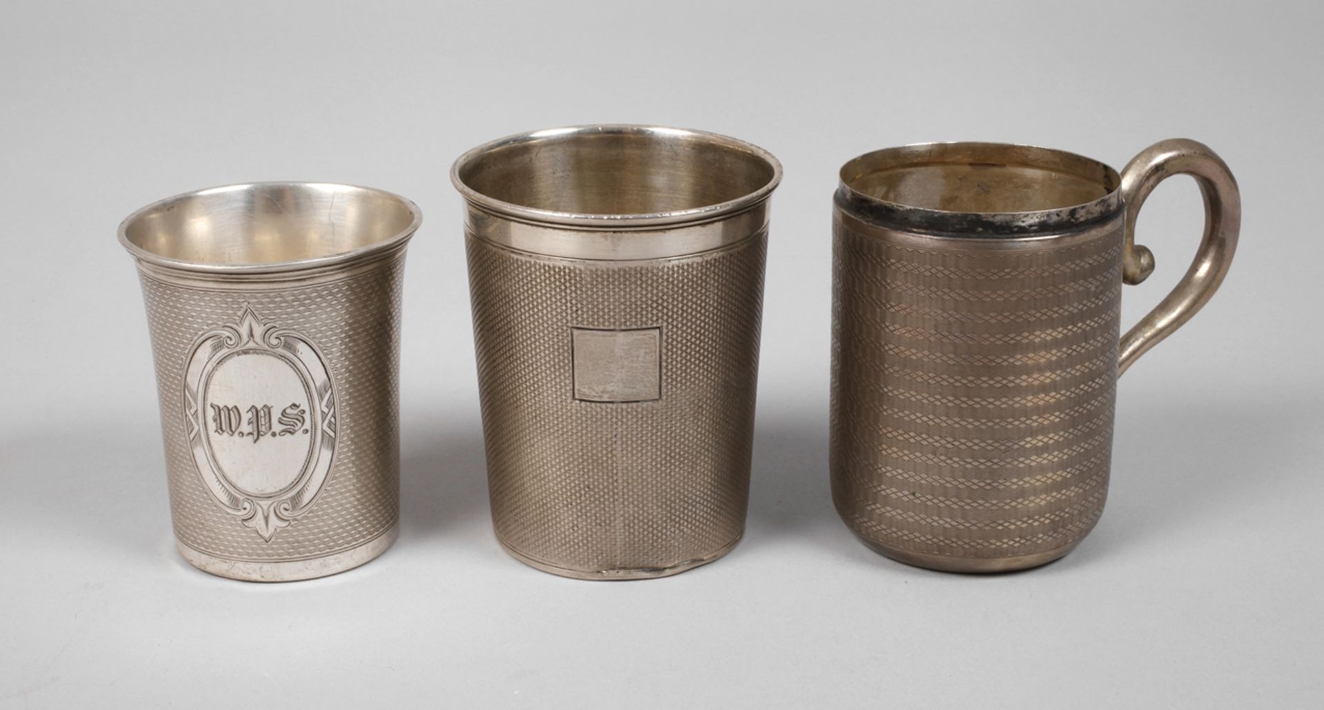 Three silver cups