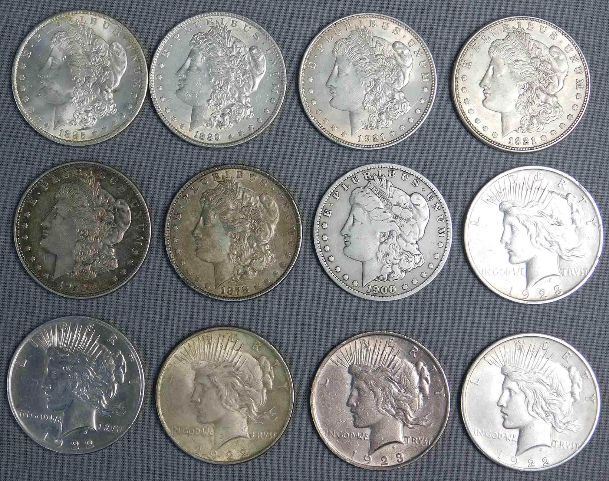 12 Silber Dollar Münzen. 1923 und älter.
