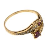 GOLD CONTRARY RING WITH RUBIES AND DIAMONDS