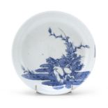 A SMALL WHITE AND BLUE PORCELAIN DISH. ARITA JAPAN 1670/1680.