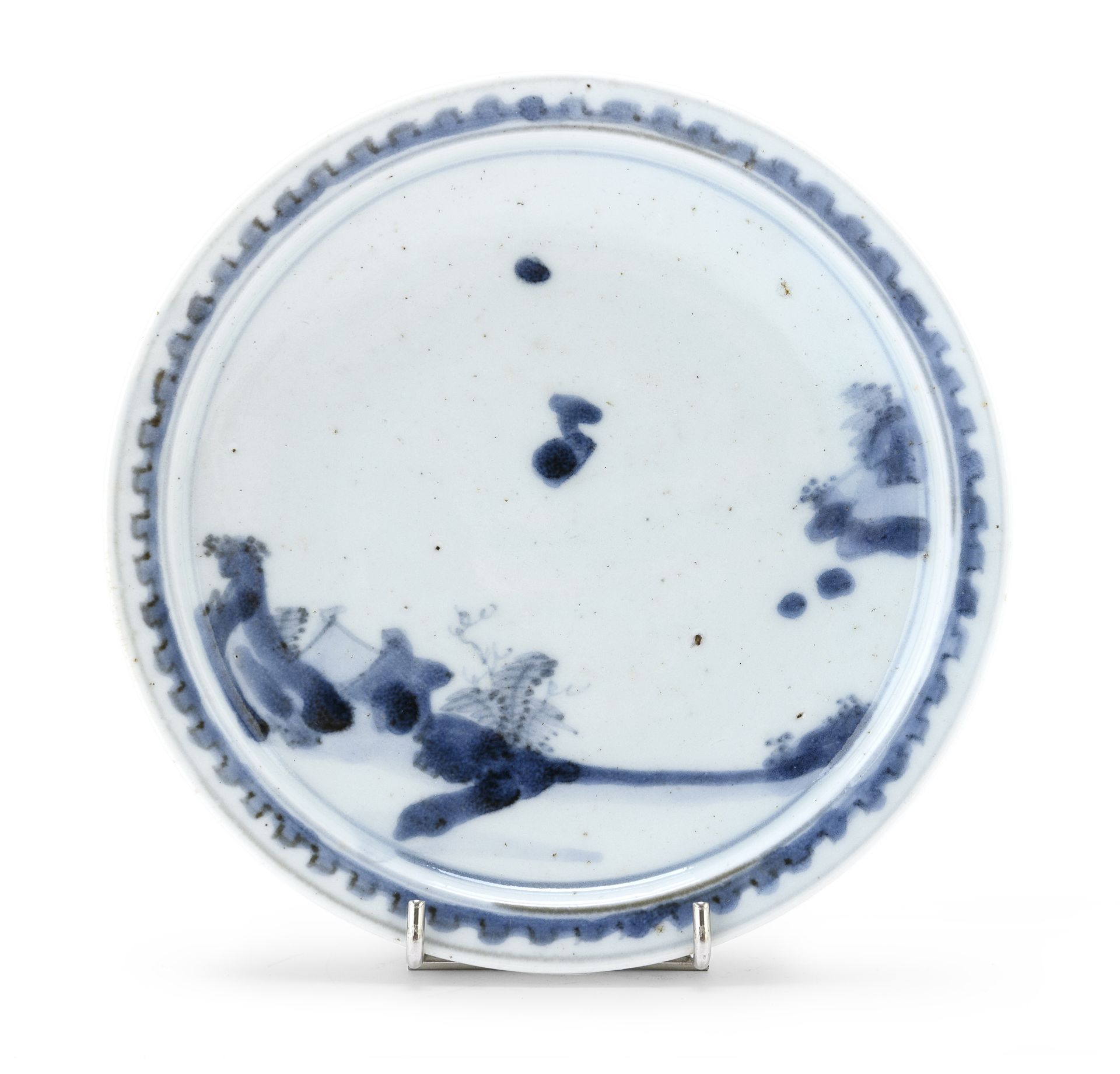 A JAPANESE WHITE AND BLUE PORCELAIN DISH, SHOKI IMARI 1630/1640