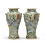 A PAIR OF CHINESE POLYCHROME AND ENAMELED PORCELAIN VASES FIRST HALF 20TH CENTURY.