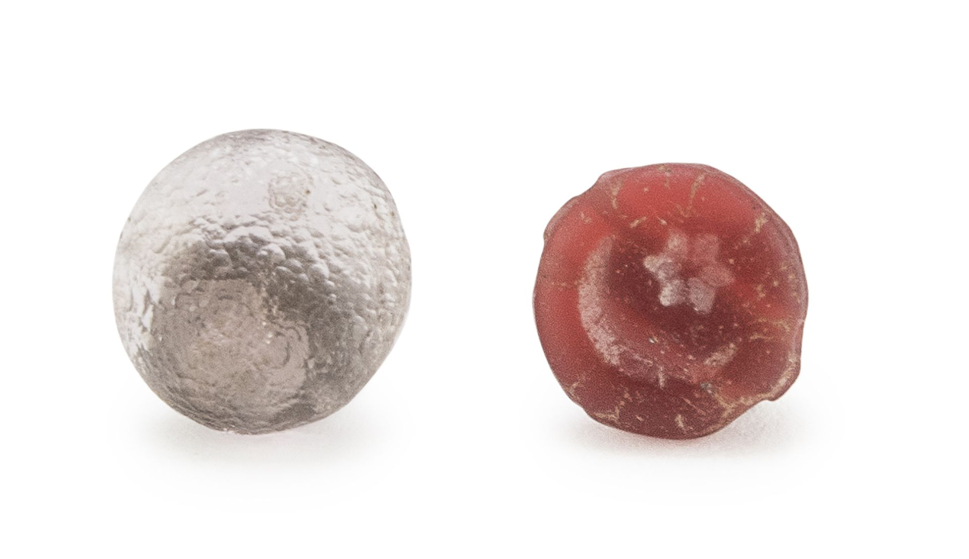 A CARNELIAN AND A PEARL IN GLASS PASTE, 1st-3rd CENTURY