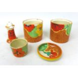 A collection of Clarice Cliff 'Nasturtium' pieces, comprising two drum shaped preserve pots, without