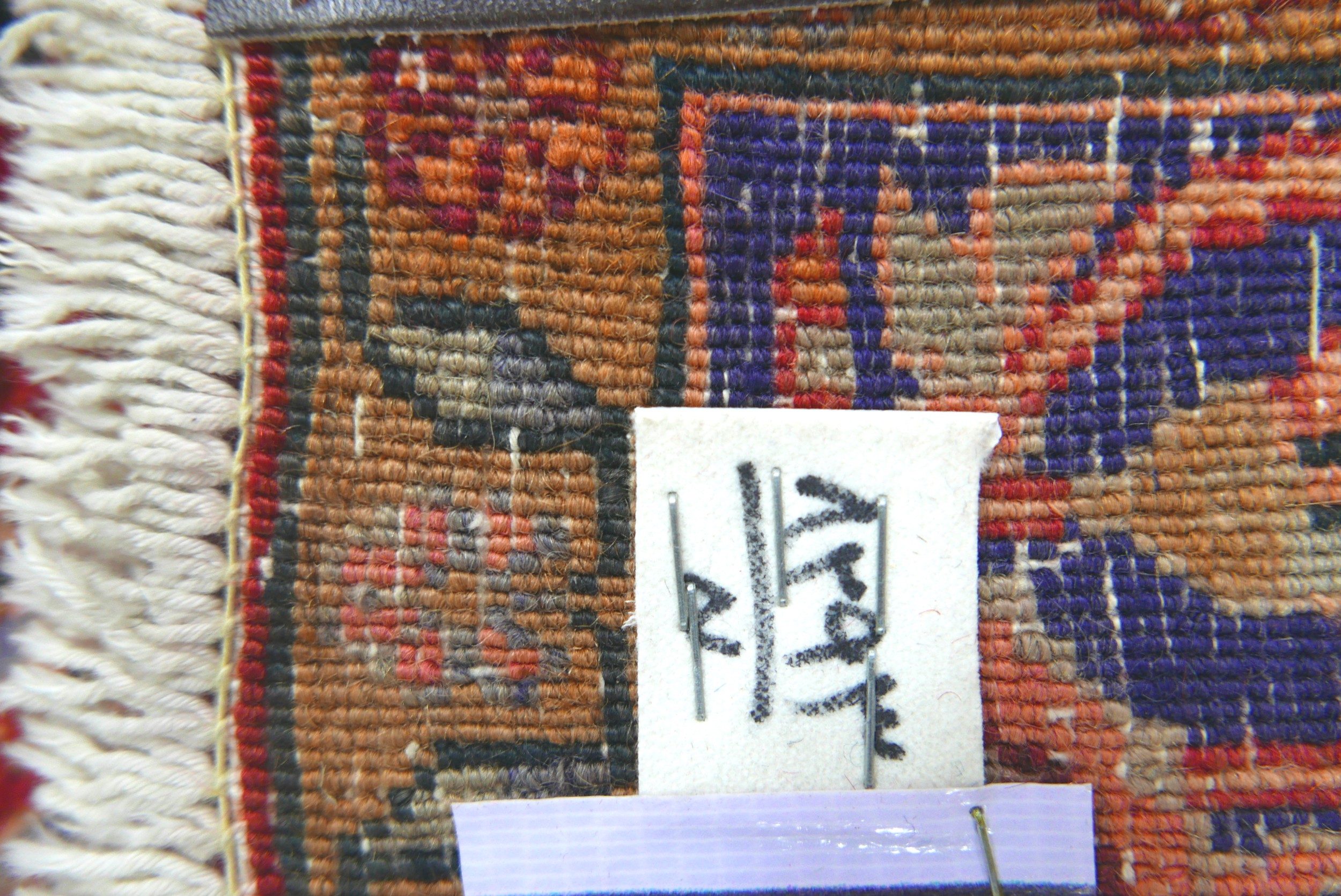 A Bijar rug, on red ground, blue central medallion with pendant anchors, on densely decorated field, - Image 3 of 4