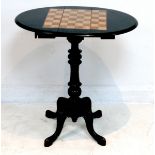A Victorian games table, ebonised mahogany and fruitwood, with chess board to the oval drop leaf