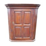 A George III oak flat fronted corner cabinet, 74.5 by 44.5 by 85.5cm high.