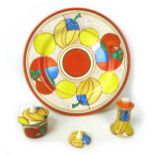 A collection of Clarice Cliff 'Melon' design items, comprising Bizarre Fantasque plate, 25cm