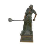 A 20th century German bronzed figurine of a metal worker, signed 'G. Holand 1900', 20 by 10 by