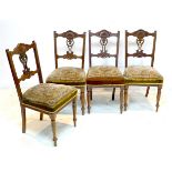 A set of four late Victorian mahogany dining chairs, tapestry seats, turned legs, each 40 by 46 by