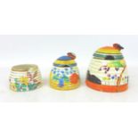 A group of three Clarice Cliff Beehive honey pots, Including 'Tulips','Canterbury Bells', and '