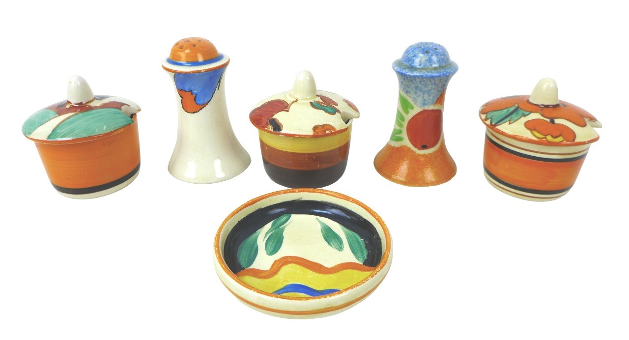 A mixed group of Clarice Cliff, including three cruet mustard pots, including two 'Farmhouse' and