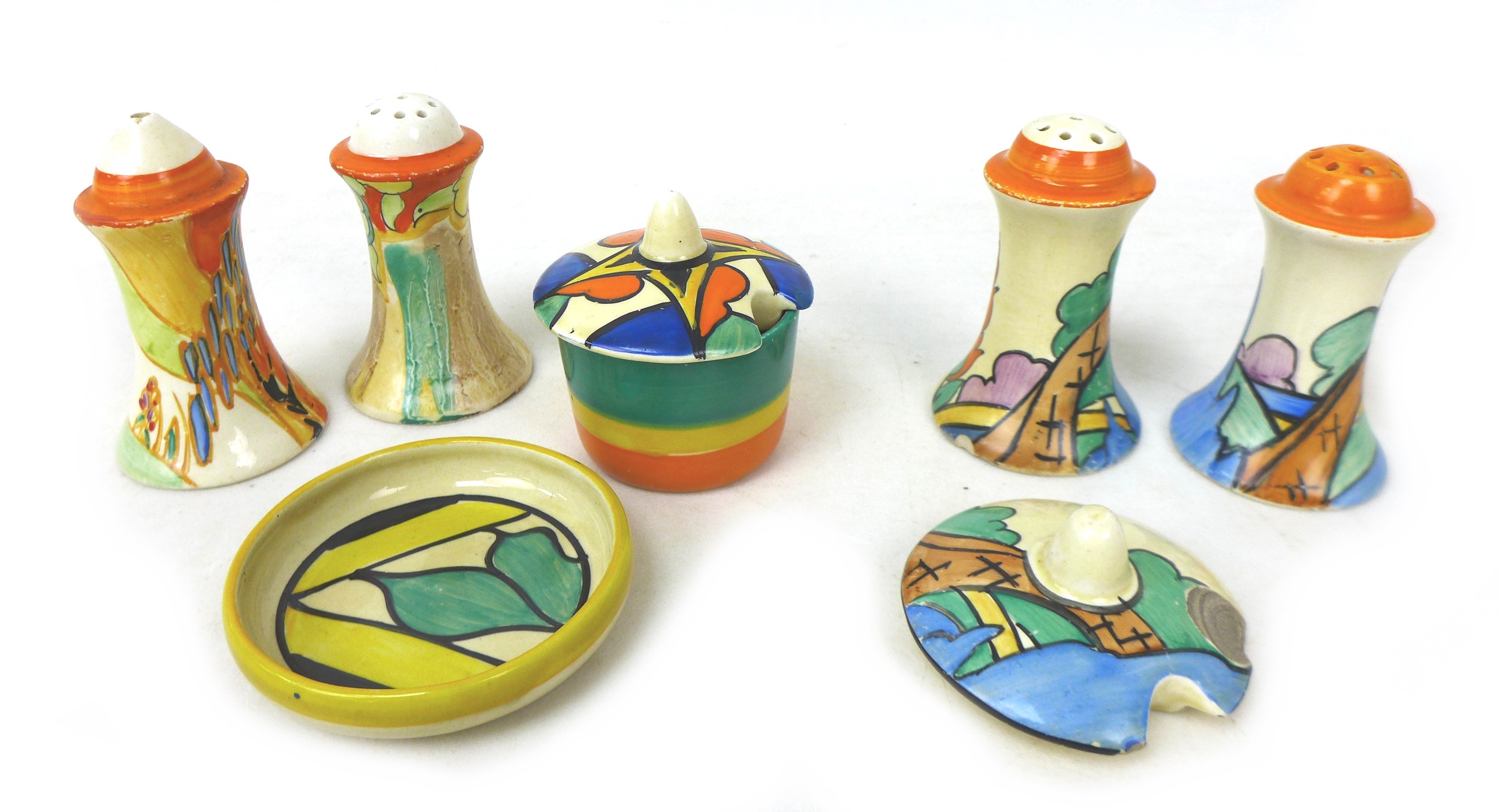 A mixed collection of Clarice Cliff, comprising a 'Double V' cruet pot and pin dish, two 'Orange
