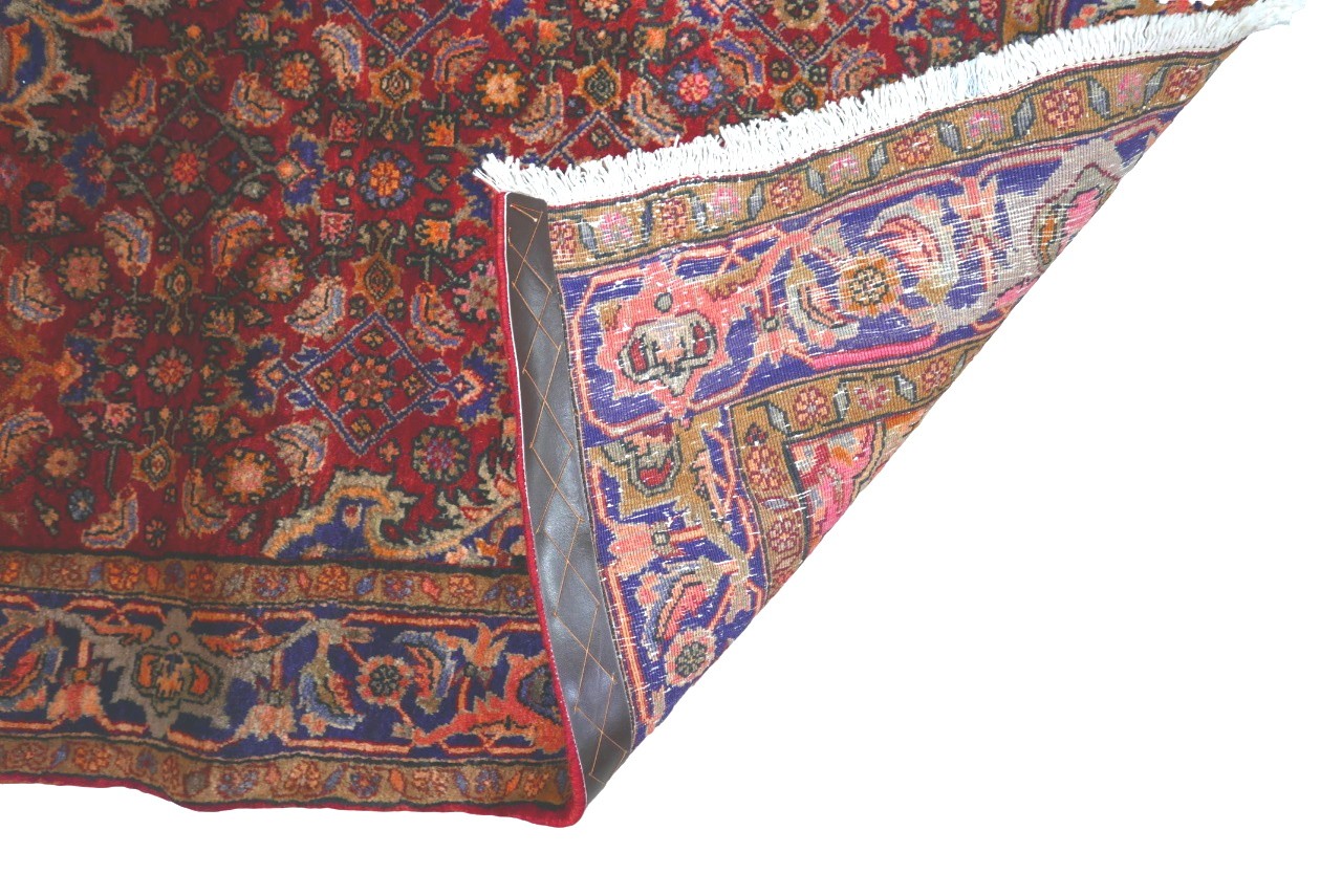 A Bijar rug, on red ground, blue central medallion with pendant anchors, on densely decorated field, - Image 2 of 4