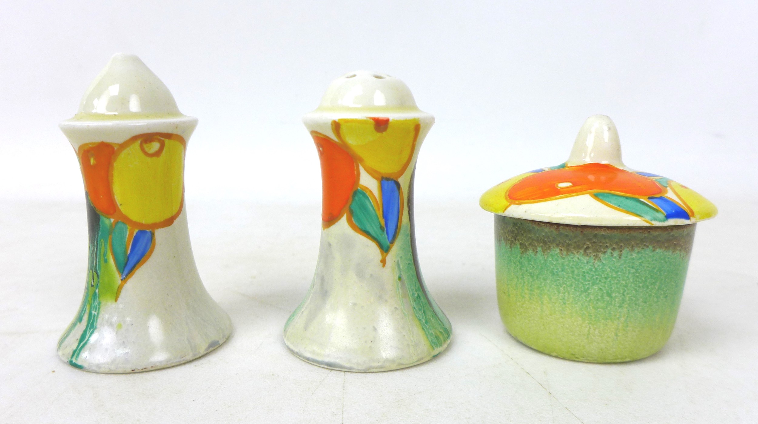 A Clarice Cliff 'Delecia Citrus' Muffineer cruet set, Bizarre and Newport Pottery marks to base, 8cm