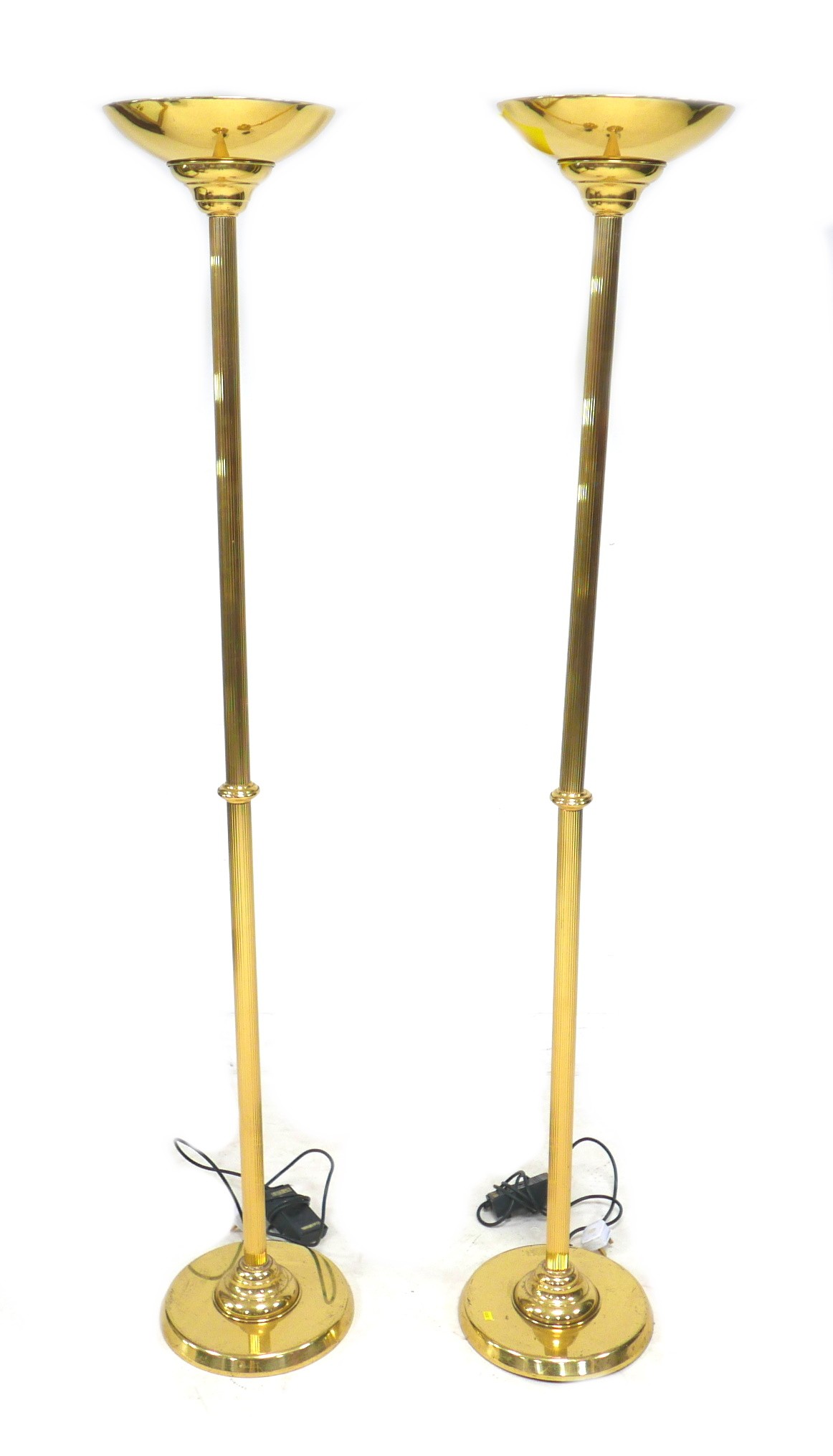 A pair of modern brass effect uplighters, in Art Deco style, with reeded columns on circular