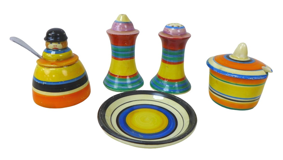 A collection of Clarice Cliff Banded wares, including a 'United Service' cruet mustard with spoon,