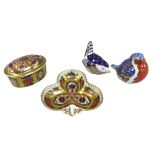 A group of four Royal Crown Derby bone china items, comprising ‘Robin’ paperweight, ‘Wren’